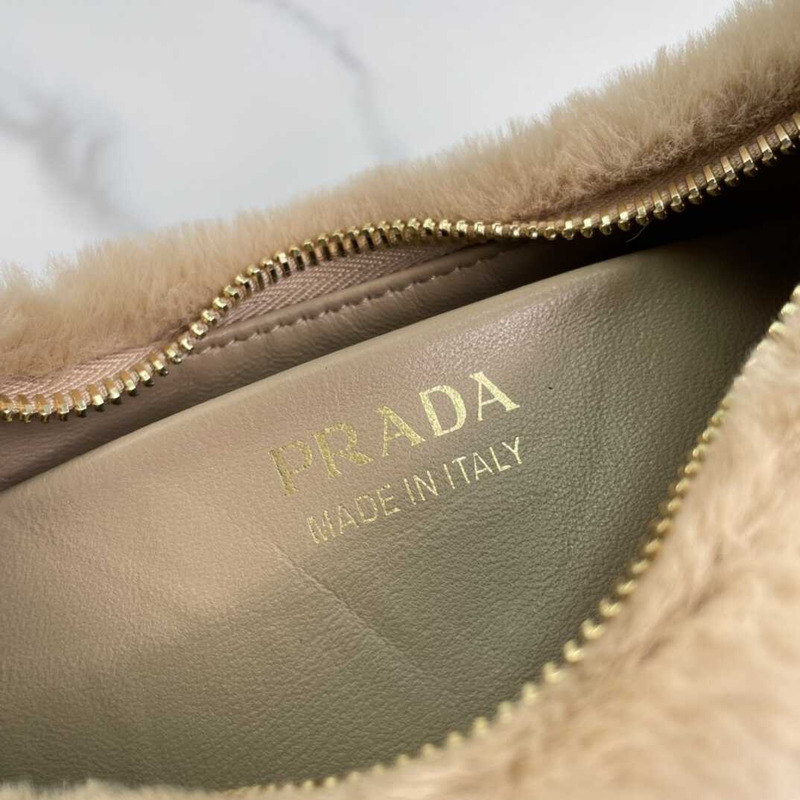 Pra*a arqué shearling and leather shoulder bag beige