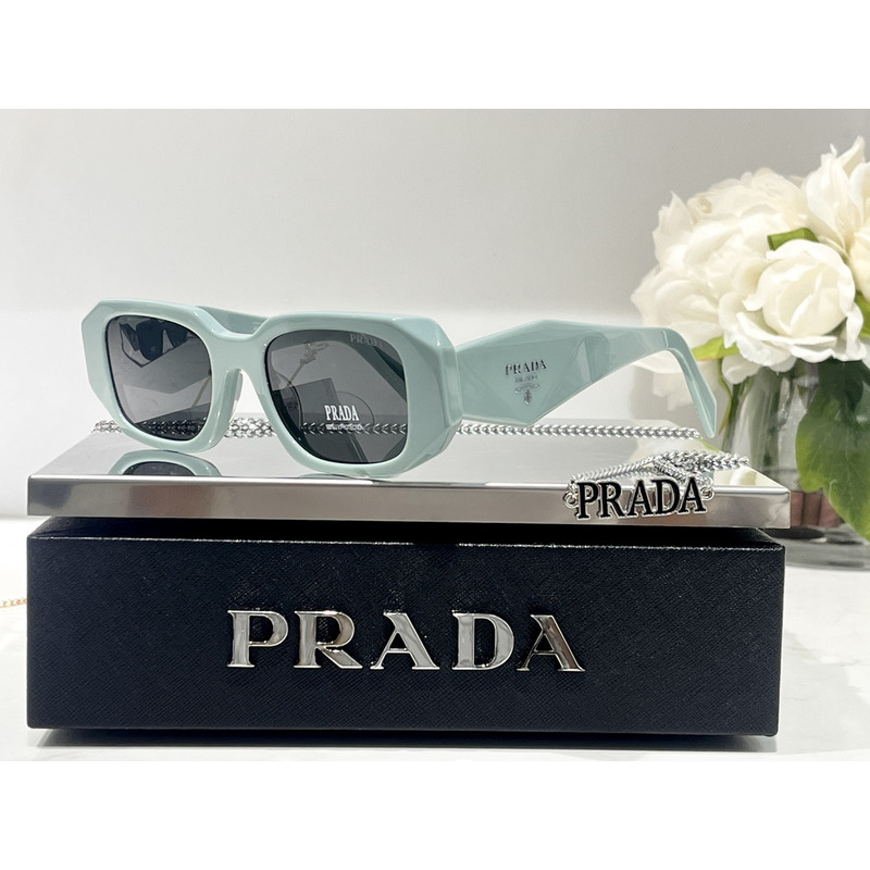 Pra*a sunglasses with Pra*a logo slate gray lenses light blue