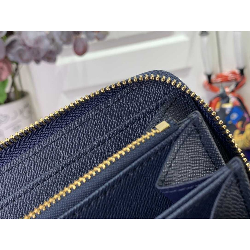 l**is V*t*n monogram zippy wallet denim blue