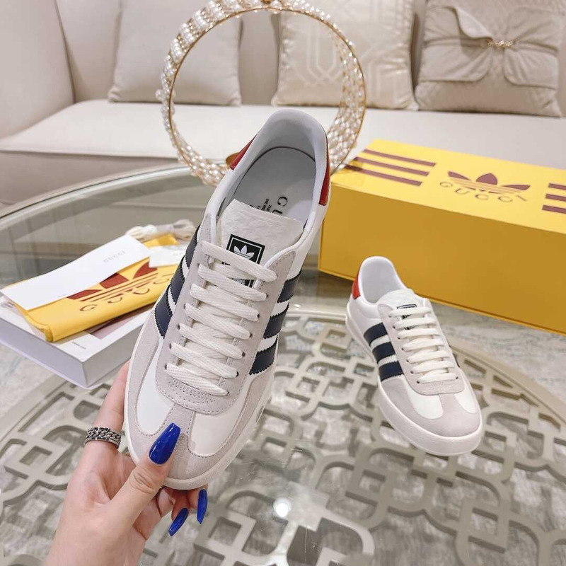 g*u*i x Ad*s gazelle sneakers white