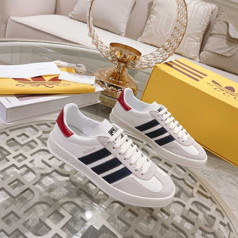 g*u*i x Ad*s gazelle sneakers white