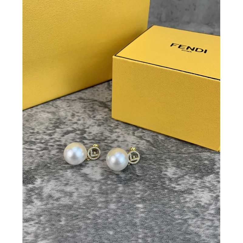 F**di f with pearl earrings