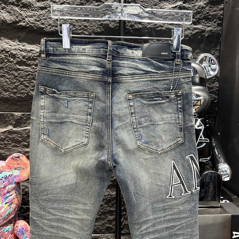 Amiri Logo Distressed Skinny Jeans