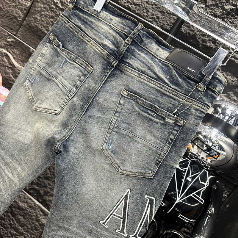 Amiri Logo Distressed Skinny Jeans