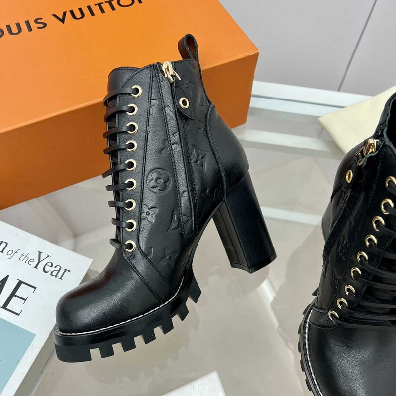 l**is V*t*n calfskin ankle boots black