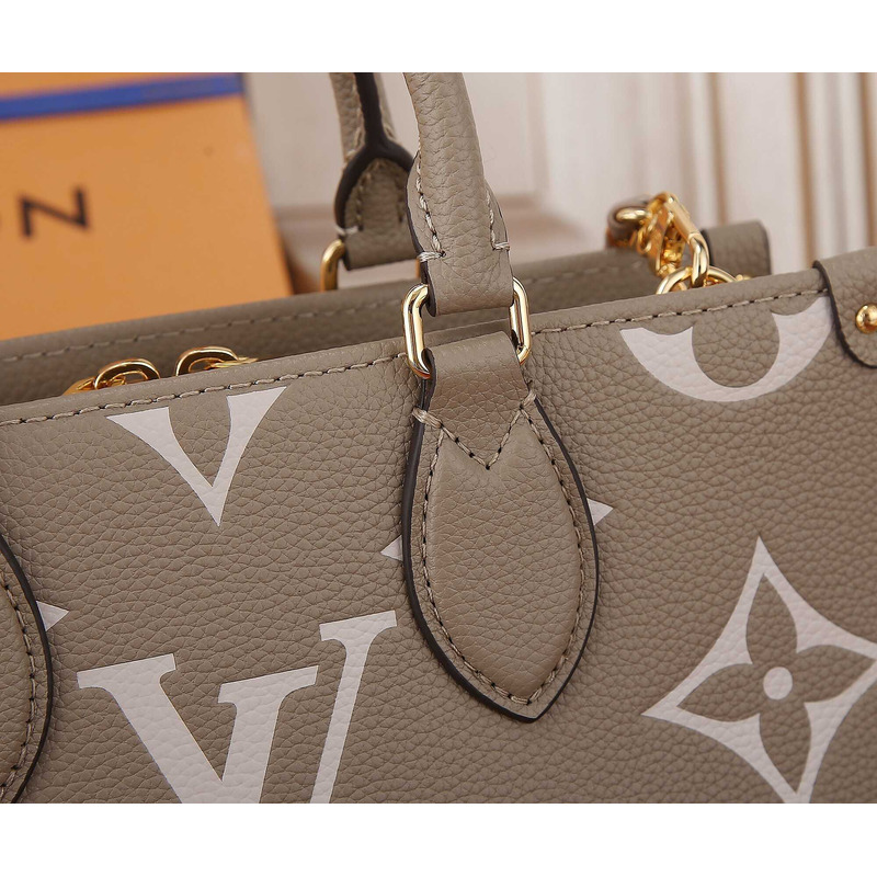 l**is V*t*n onthego east west bicolour monogram empreinte leather dove/cream