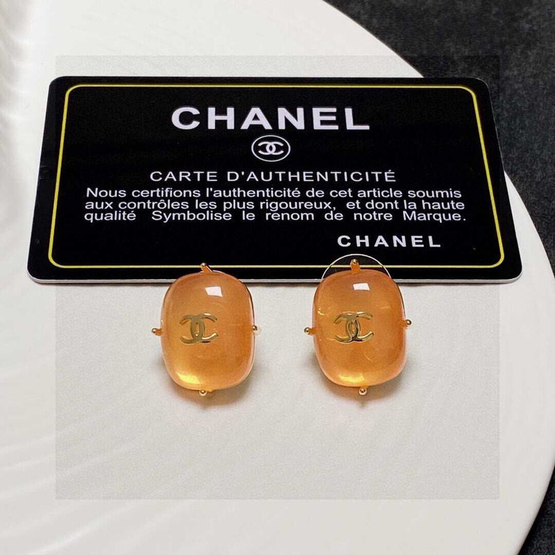 Ch*el cc logo earrings orange tone