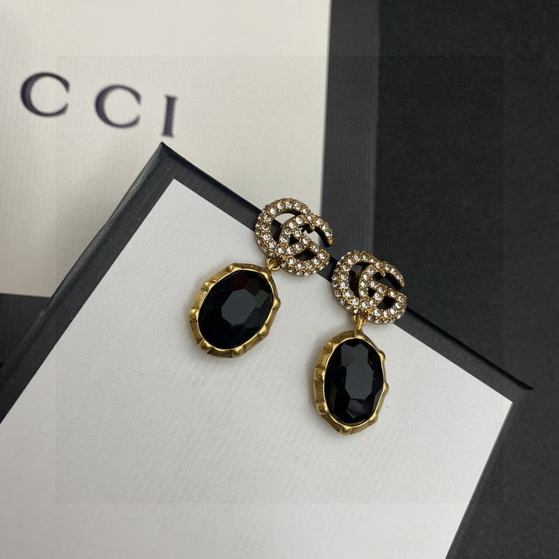 G*u*i crystal earrings gold and black