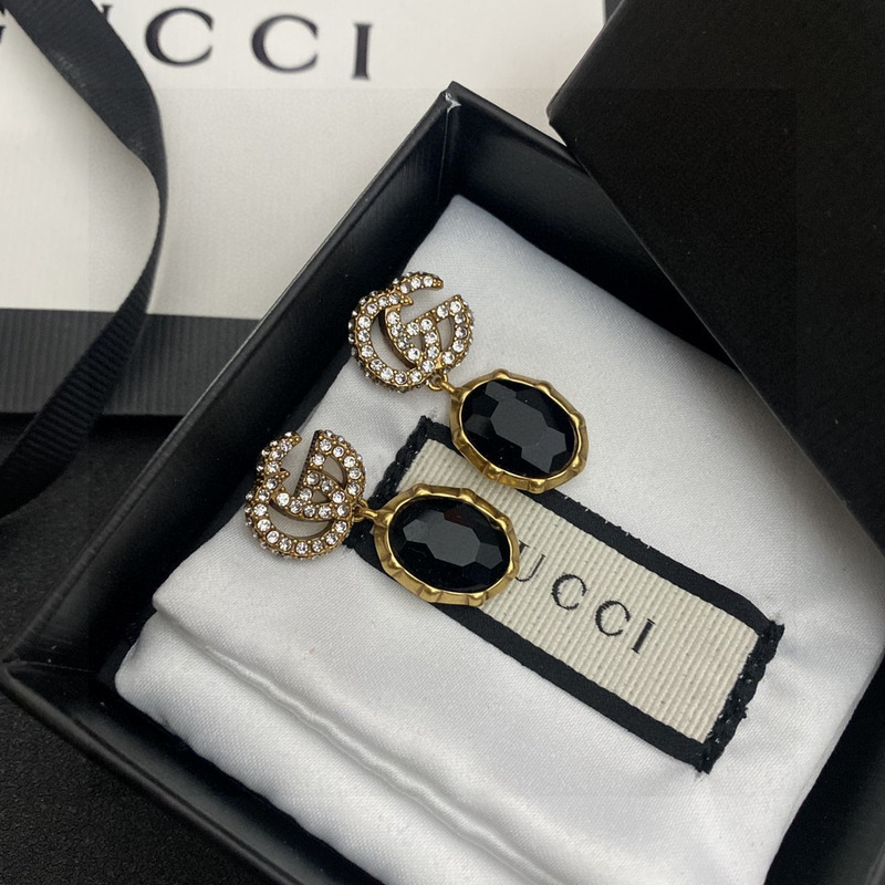 G*u*i crystal earrings gold and black