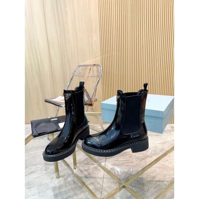 Pra*a metal triangle logo chelsea boots in black