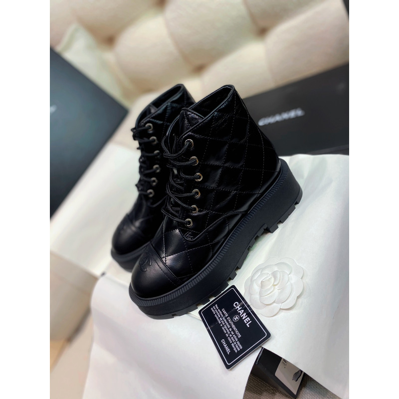 Ch*el quilted calfskin and lambskin boots black