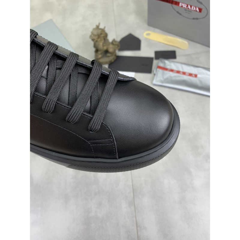 Pra*a logo leather sneaker in black