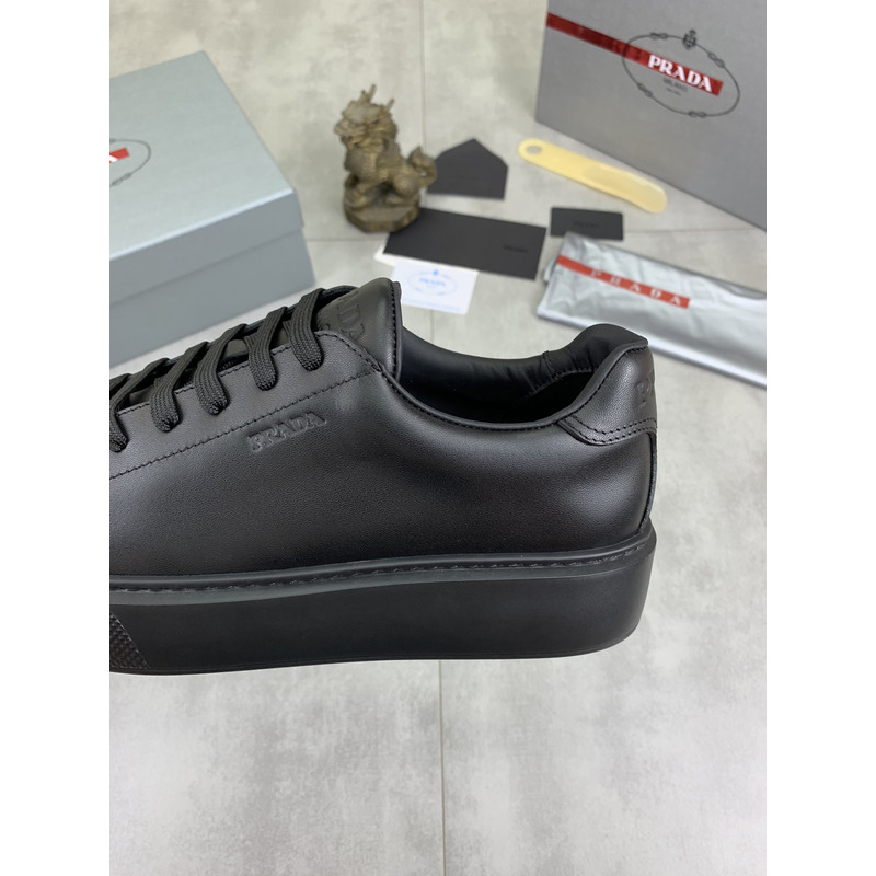 Pra*a logo leather sneaker in black