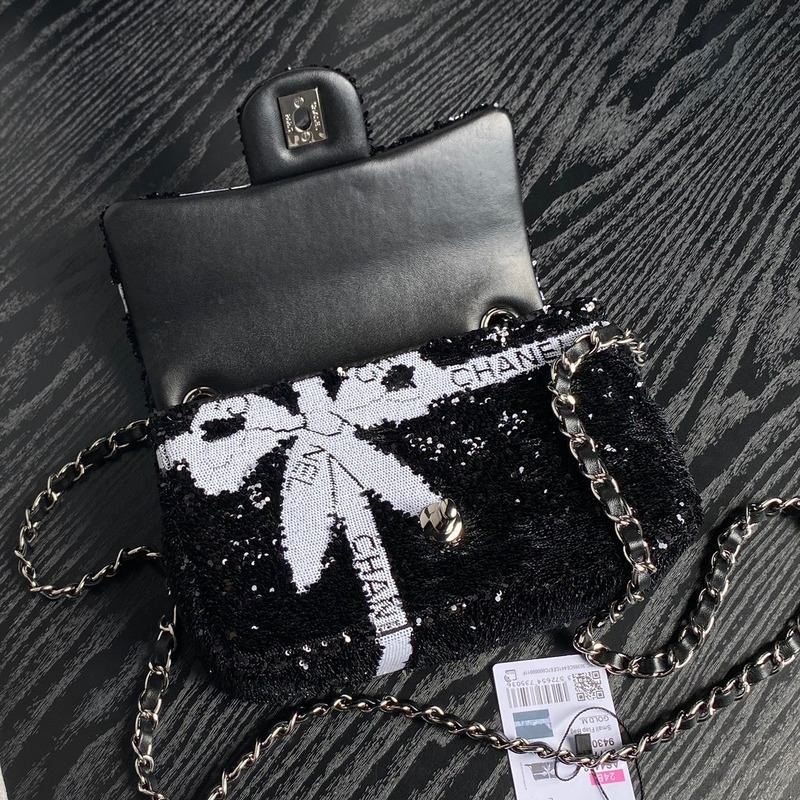 Ch*el bowknot flap bag sequins & silver-tone metal black & white