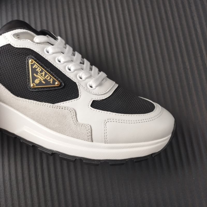 Pra*a suede and leather sneaker white black