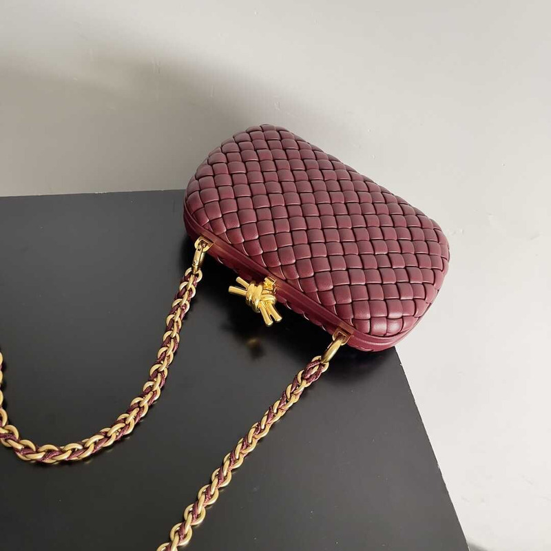 Bo*te*ga ve*ne*ta knot minaudiere clutch with chain in intreccio calfskin burgundy