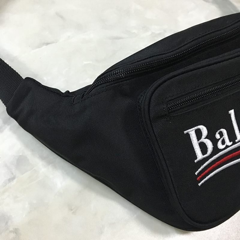 Ba*len*cia*ga explorer belt bag campaign logo