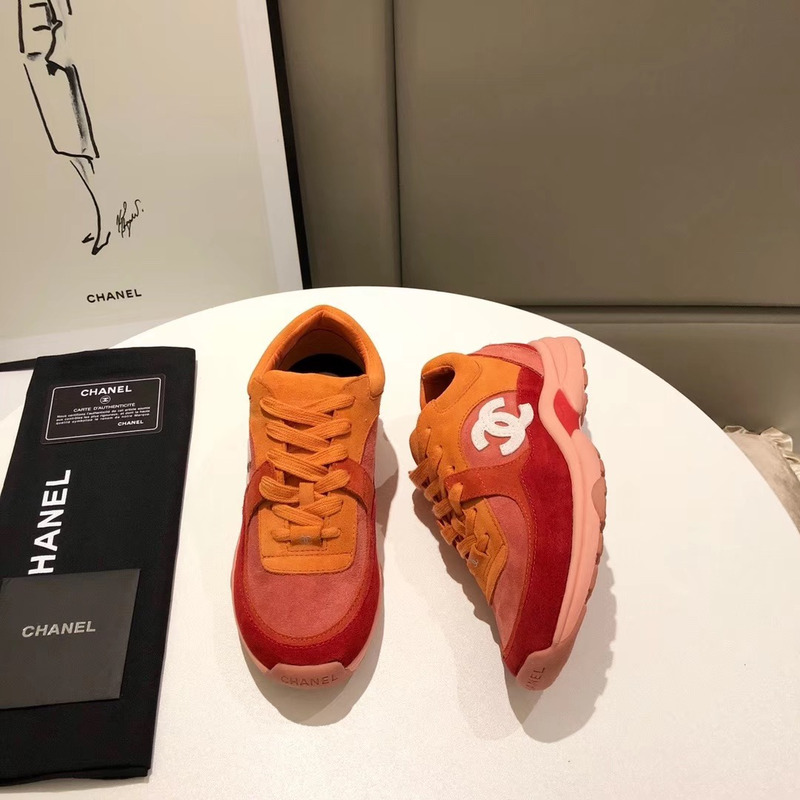 Ch*el suede calfskin sneakers in orange/red