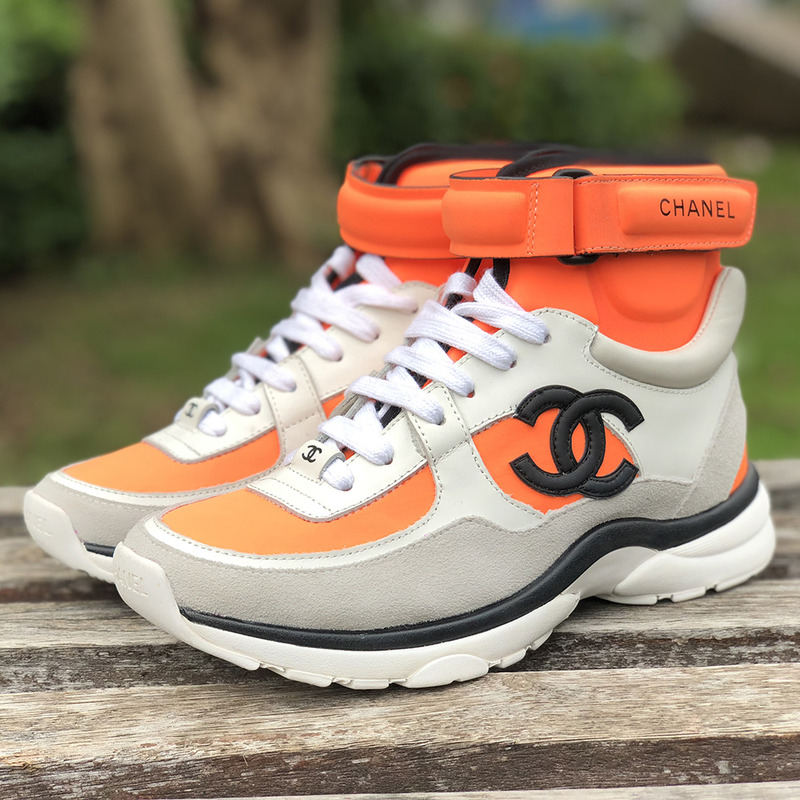 Ch*el calfskin & velvet high top sneaker in orange black& white