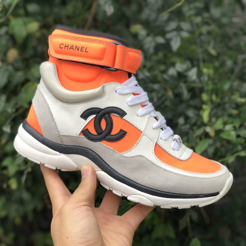 Ch*el calfskin & velvet high top sneaker in orange black& white