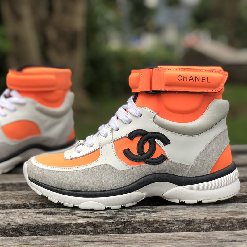 Ch*el calfskin & velvet high top sneaker in orange black& white