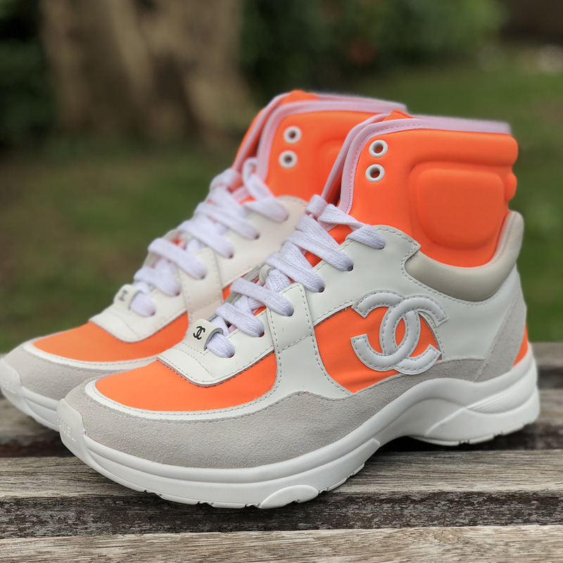 Ch*el calfskin & velvet high top sneaker in orange & white