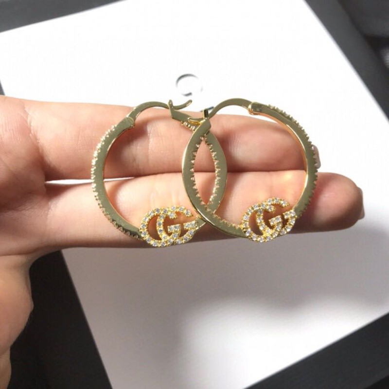 G*u*i earrings