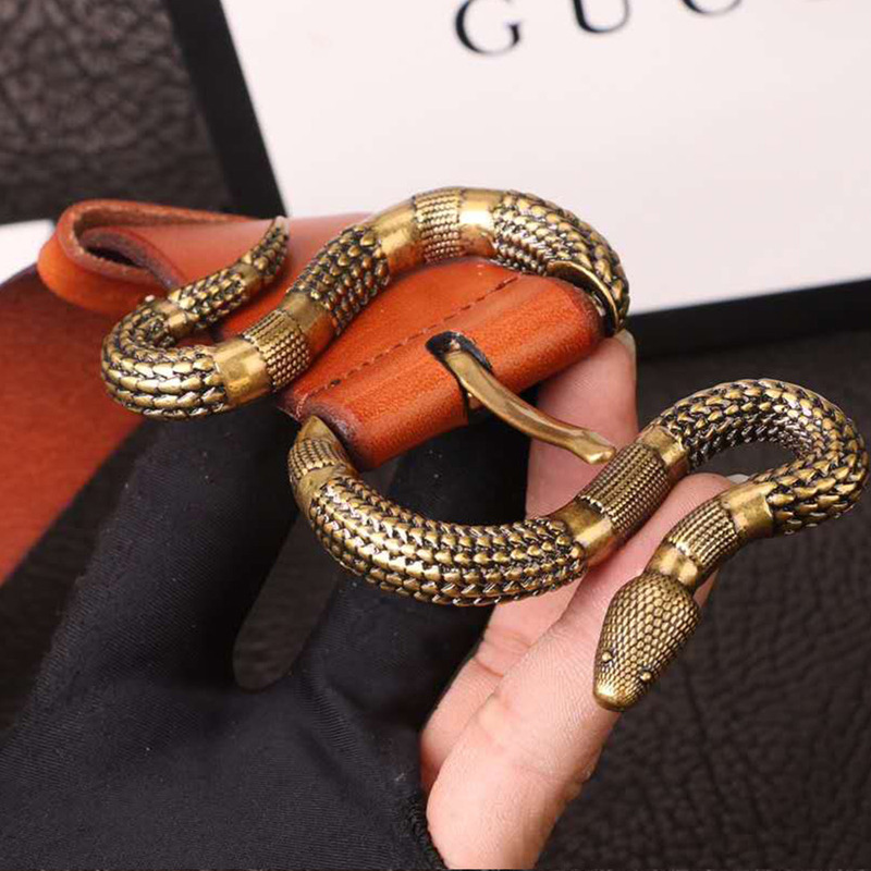 G*u*i orange leather belt with snake buckle