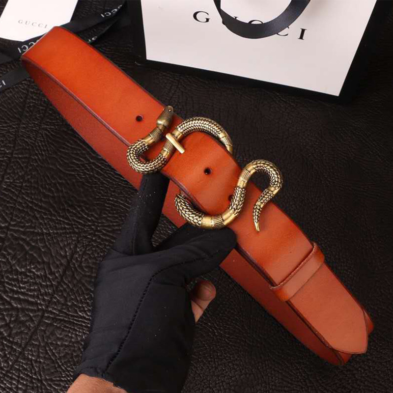 G*u*i orange leather belt with snake buckle