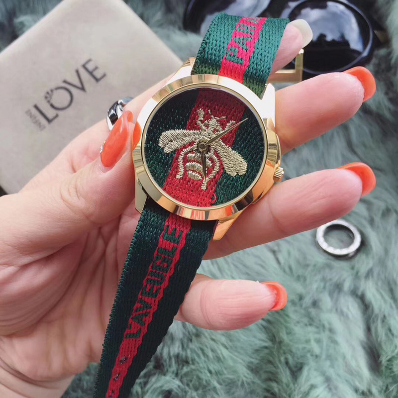 G*u*i red and green web watches with bee embroidery