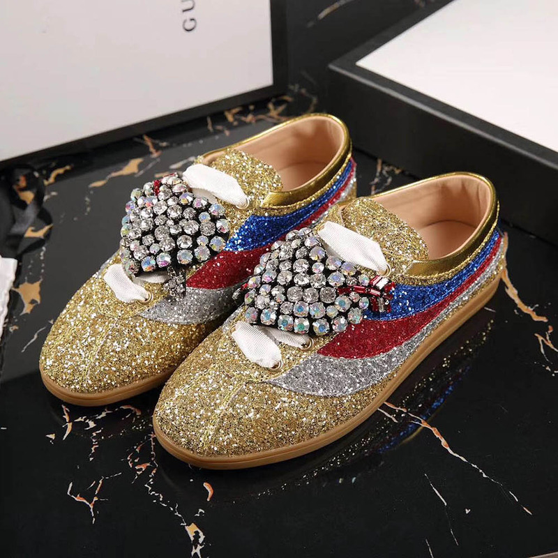 G*u*i falacer glitter sneaker with web in gold