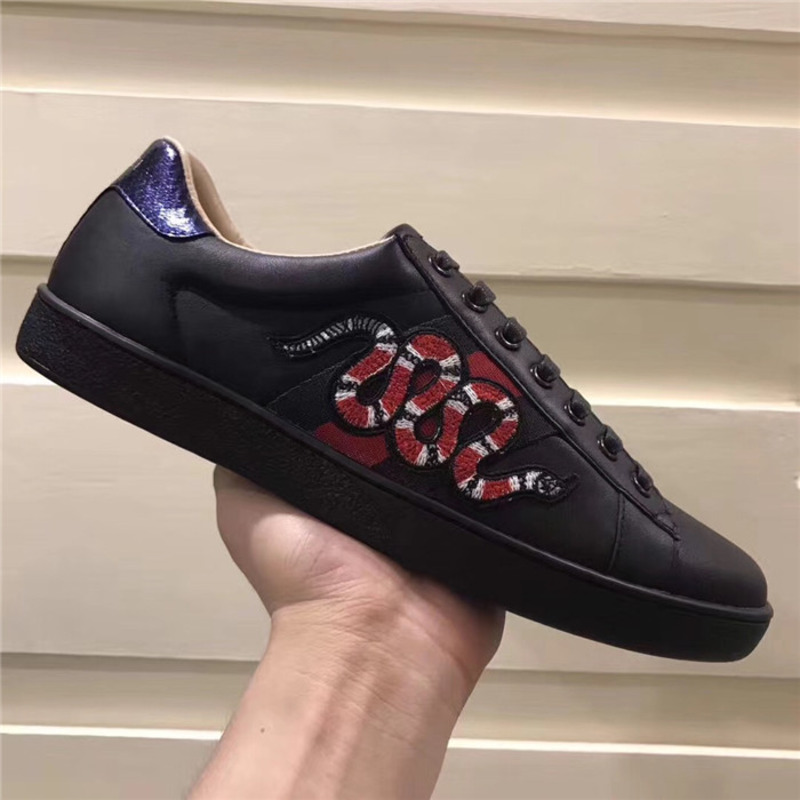 G*u*i designed black snake sneakers