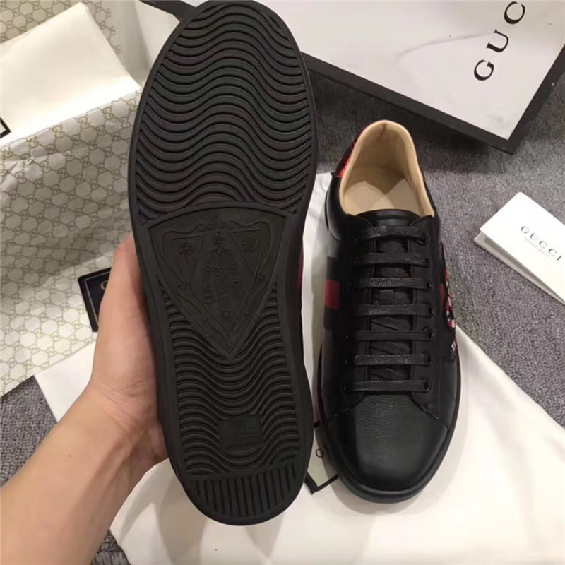 G*u*i designed black snake sneakers