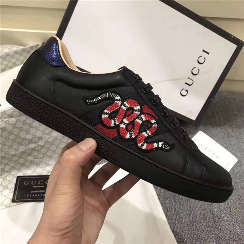 G*u*i designed black snake sneakers