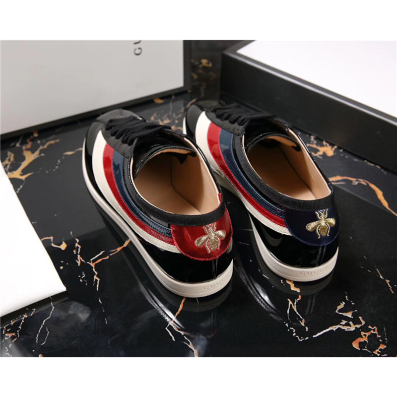 G*u*i patent leather low-top sneakers with web