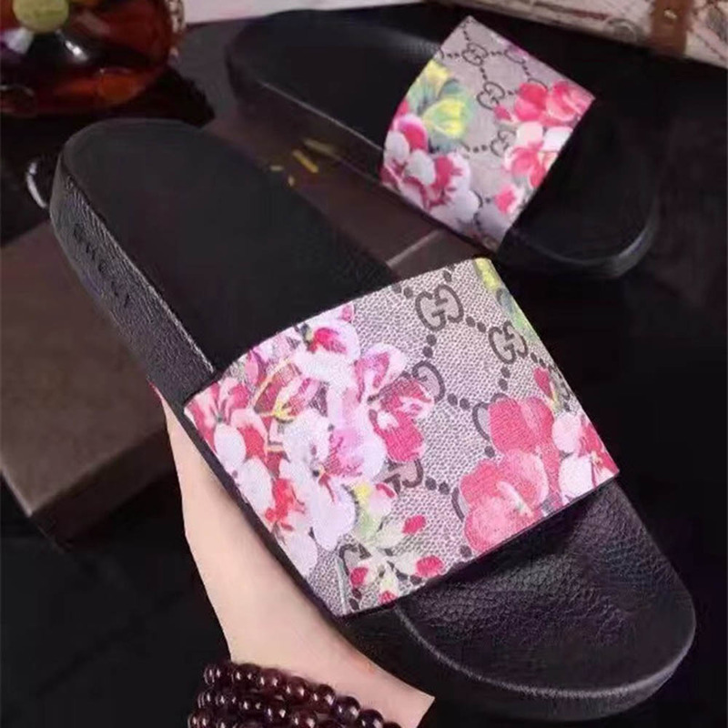 G*u*i bird and flower flip flops