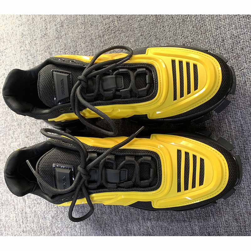 Pra*a cloudbust thunder knit sneakers in black/yellow