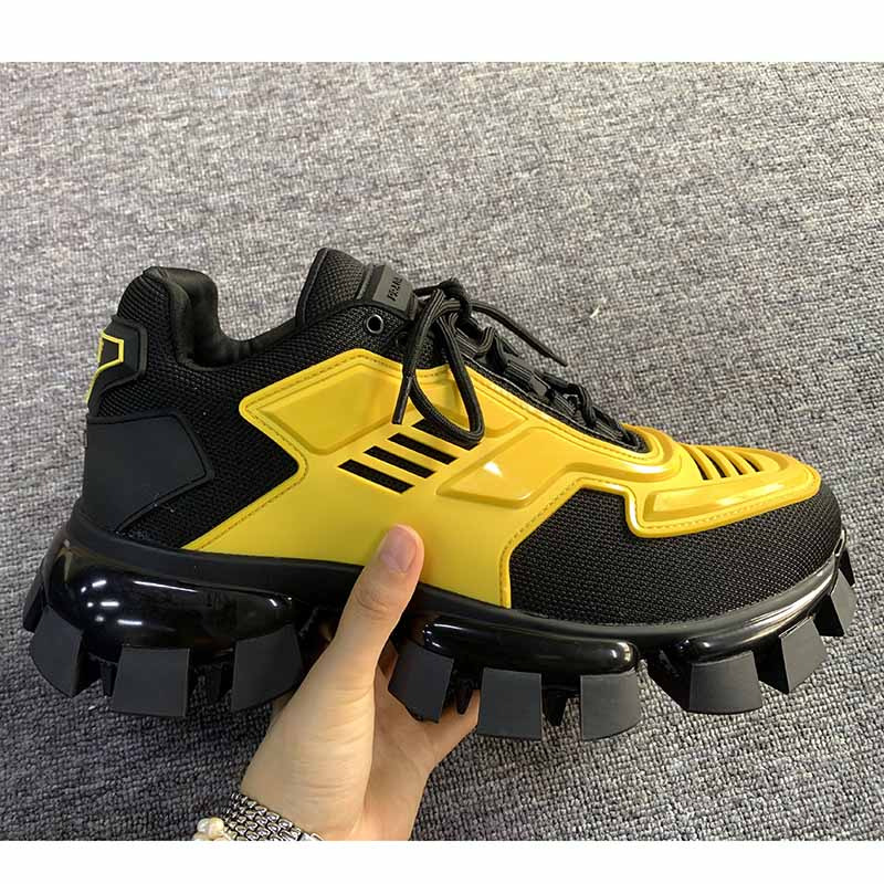 Pra*a cloudbust thunder knit sneakers in black/yellow